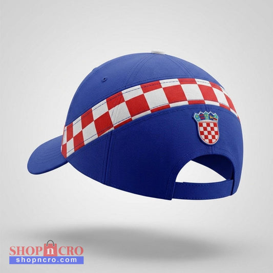 Blue cap with a red and white checkered band and emblem on a light gray background