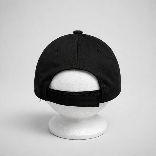 Baseball Cap Prvo Bijelo Polje Black cap on a white mannequin head against a light gray background on shopncro.com