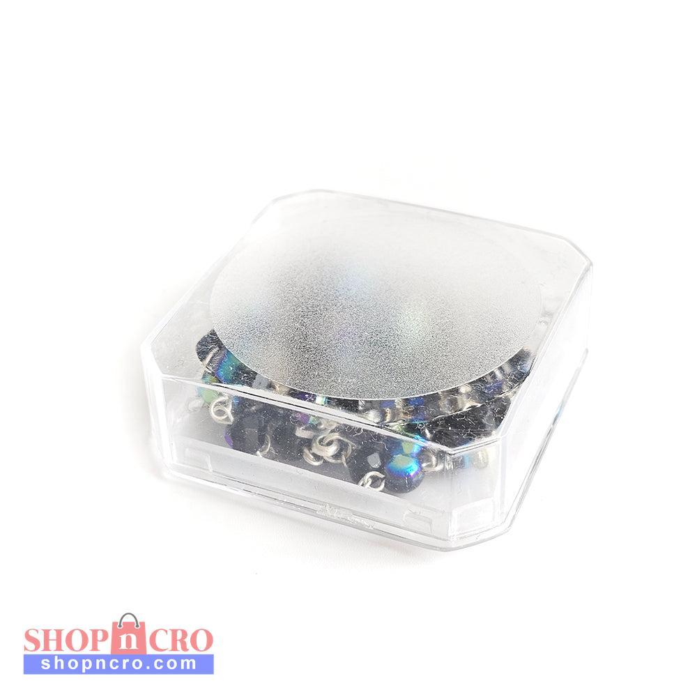 Black Crystal Catholic Rosary with Silver Crucifix and Alpha Omega Centerpiece Clear plastic container with a reflective lid on a white background