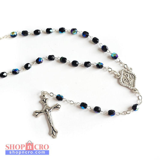 Black Crystal Catholic Rosary with Silver Crucifix and Alpha Omega Centerpiece Rosary with blue beads and silver crucifix on a white background