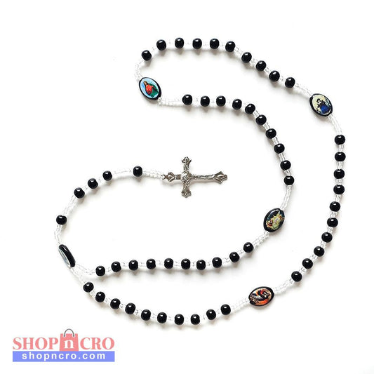 Black & White Catholic Rosary with Religious Medals – Silver Crucifix Black rosary beads with a silver cross on a white background