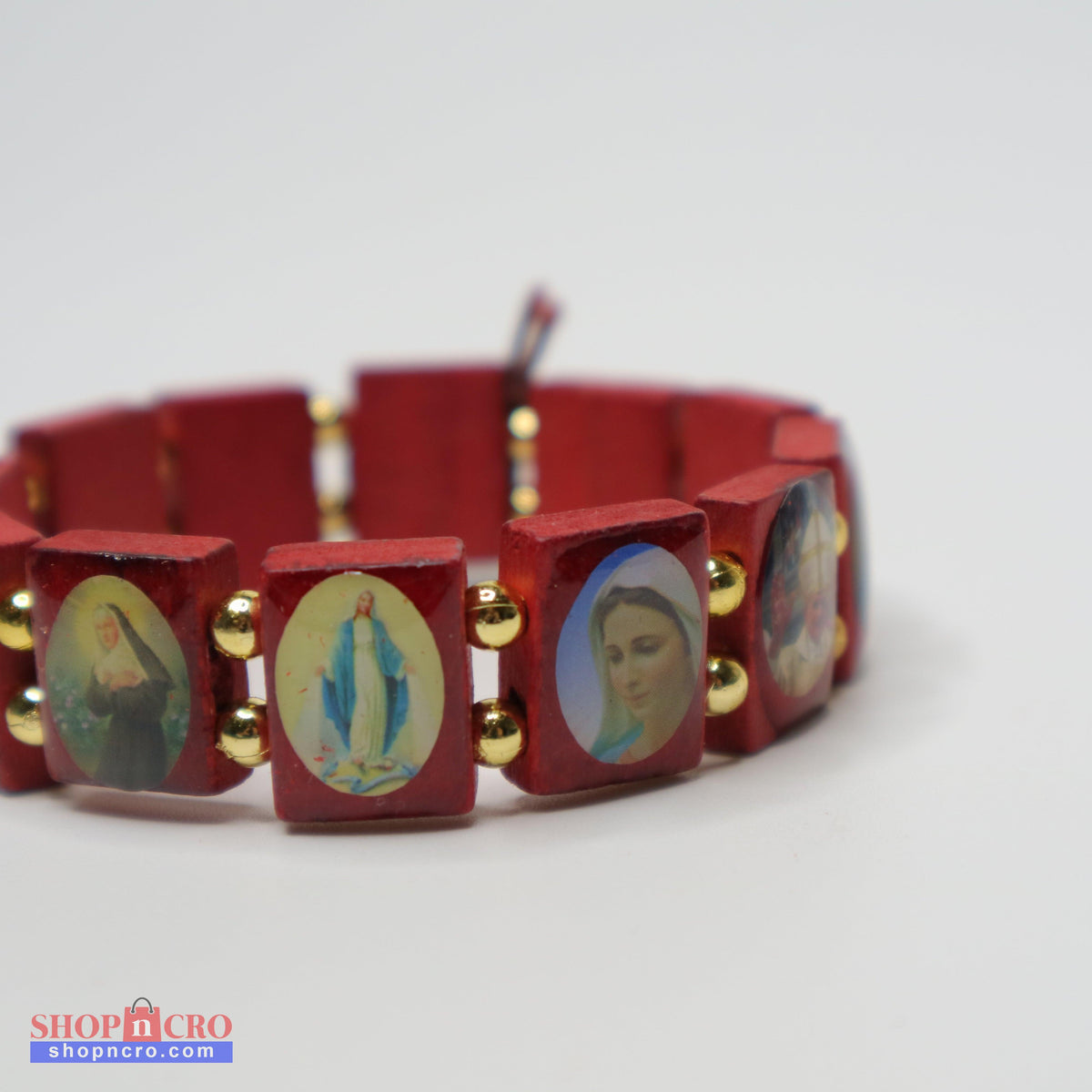 Bracelet Međugorje in Walnut Red bracelet with religious-themed charms on a white background