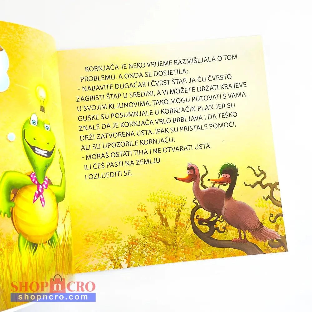 Brbljava Kornjača Open book with colorful illustrations and text on a yellow background