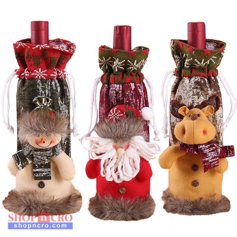Christmas Bottle Cover – Santa, Snowman & Reindeer Three Christmas-themed wine bottle covers with decorative figures on a white background snc shopncro
