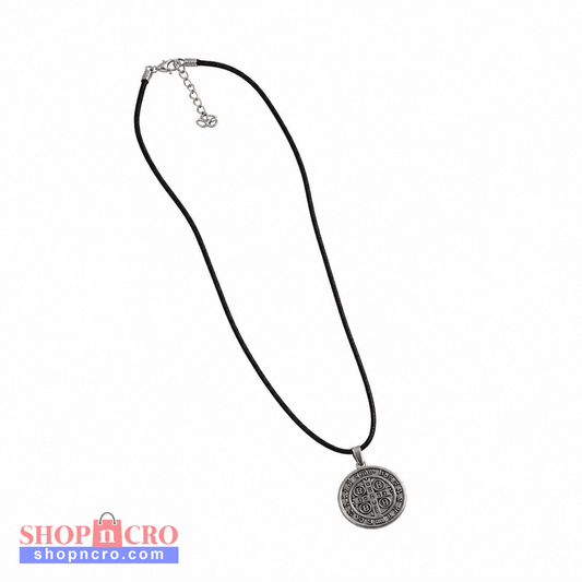 Croatian Medallion Necklace – St. Benedict Pendant (black cord) A black cord necklace with a circular silver pendant featuring an embossed floral or scroll pattern, displayed on a clean white background. shopncro