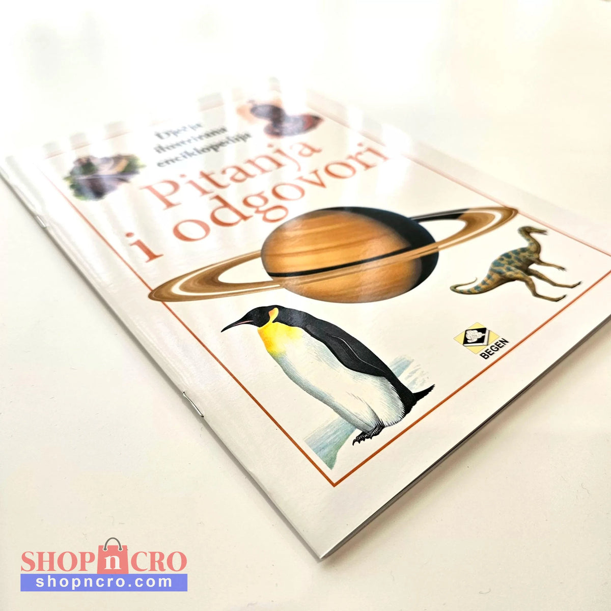 Dječje Ilustrirane Enciklopedije – Pitanja i Odgovori Book cover with a penguin, planet, and text on a light background
