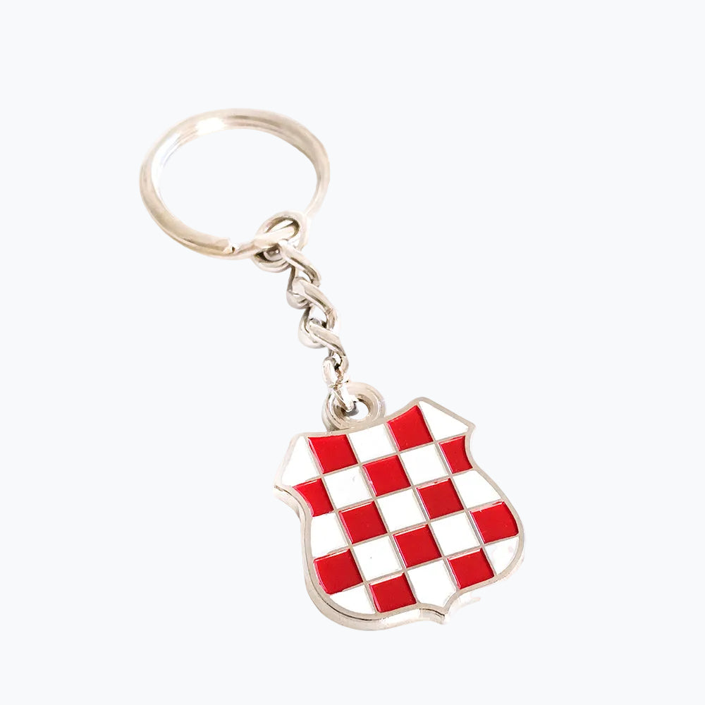 Keyring Prvo Bijelo Polje Shield Keychain with red and white checkered design on a white background