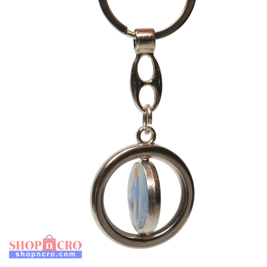 Keyring Virgin Mary & Saint Anthony Rotating Spinner Keychain with a circular design and a central gemstone on a white background