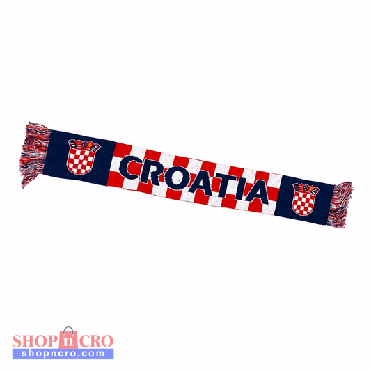 A Croatia-themed knit scarf featuring the word 'CROATIA' in navy blue letters over a red and white checkered pattern, flanked by navy blue sections with Croatian coats of arms and fringed ends. Knitted Scarf Croatia / Hrvatska