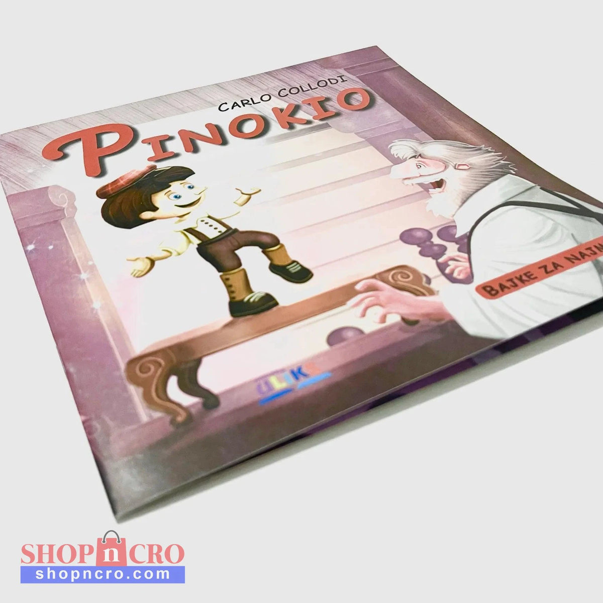 Pinokio Book cover of 'Pinokio' with illustrations of Pinokio and an old man on a bench.
