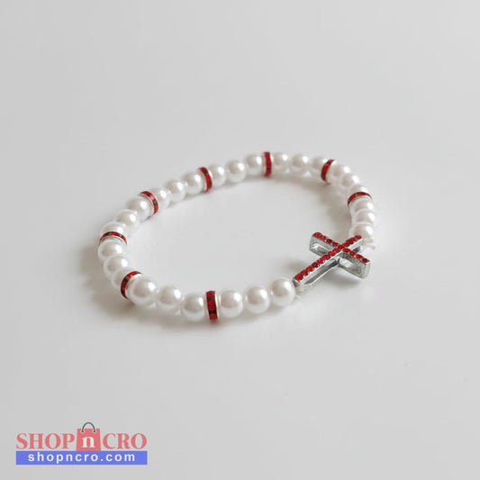 Red & White Cross Bracelet – Handmade Elastic Beaded Jewelry White beaded bracelet with red accents and a silver cross charm on a white background