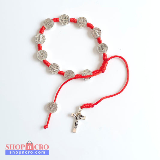 Saint Benedict Adjustable Bracelet with Cross (Red) Red bracelet with silver coin charms on a white background