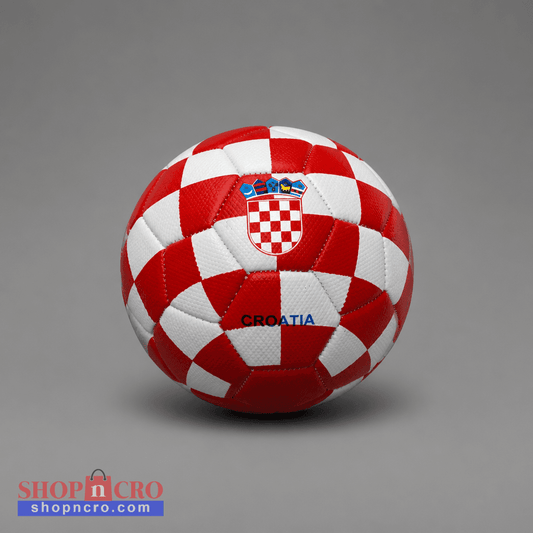 A red and white checkered soccer ball with the Croatian coat of arms and the word 'CROATIA' printed on it, photographed on a neutral gray background. Soccer Ball Croatia Checks (half size) shopncro