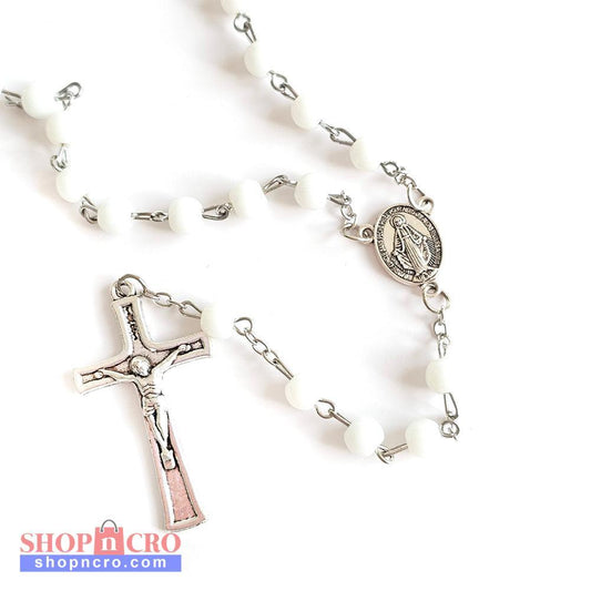 White Bead Catholic Rosary with Silver Crucifix and Virgin Mary Medal White rosary with silver cross and other charms on a white background