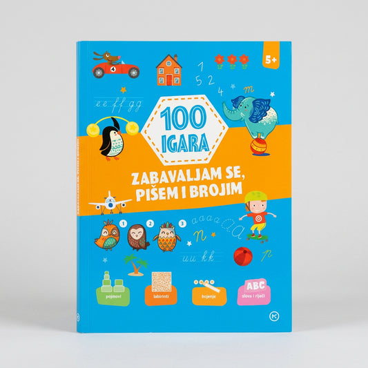 A children's book titled '100 IGARA' in Albanian, featuring a bright blue and orange cover with cartoon illustrations of animals, vehicles, and numbers, photographed on a light gray background. 100 Igara – Zabavljam Se, Pišem i Brojim 5+ shopncro