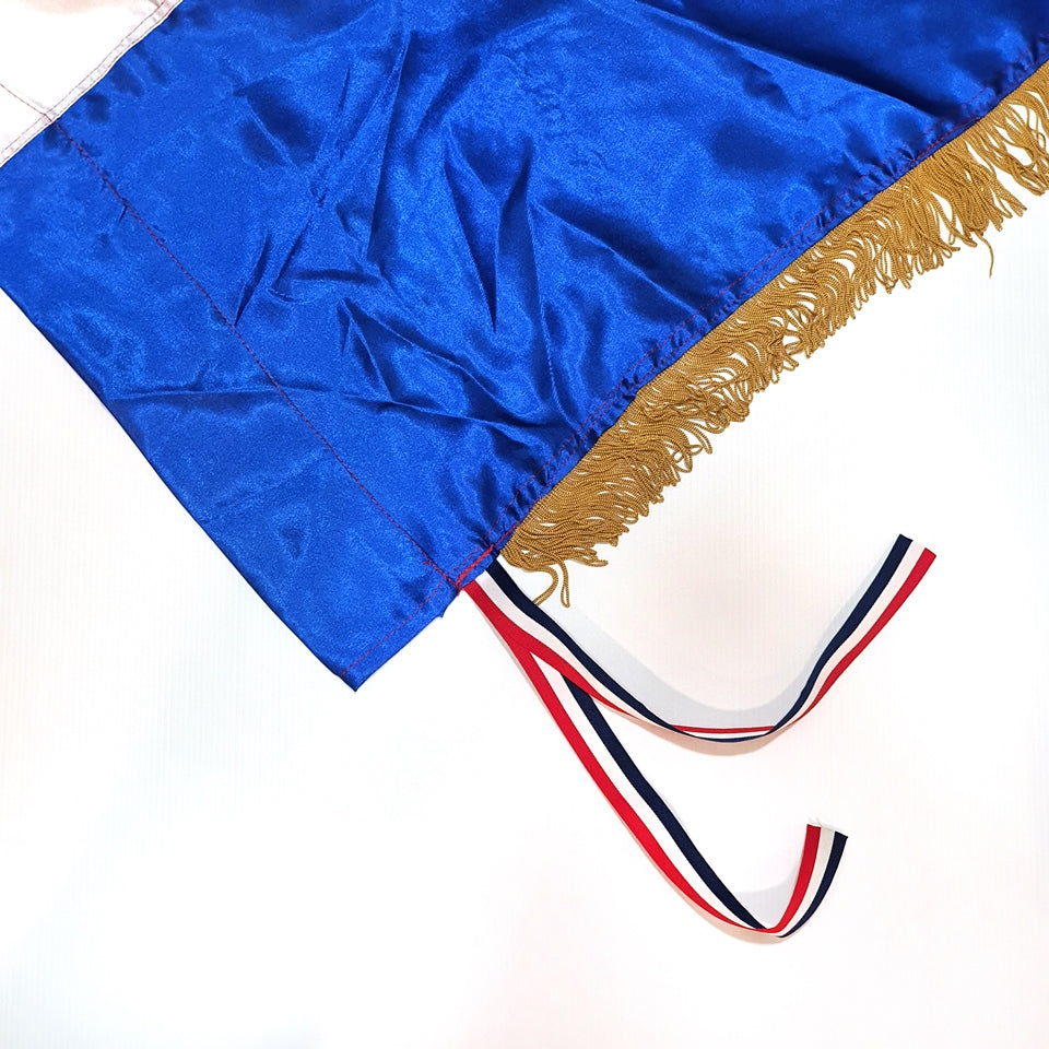 Croatian Historic Silk Flag Prvo Bijelo Polje 200cm by 100cm Blue graduation gown with gold trim and a red, white, and blue tassel on a white background