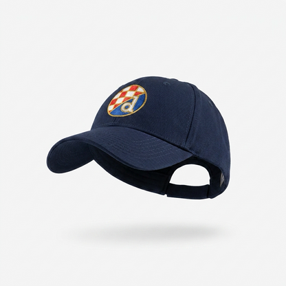 A navy blue baseball cap featuring an embroidered Croatian flag patch on the front, displayed against a clean white background with a soft shadow underneath. Baseball Cap Dinamo Zagreb in Navy Blue Shopncro.com