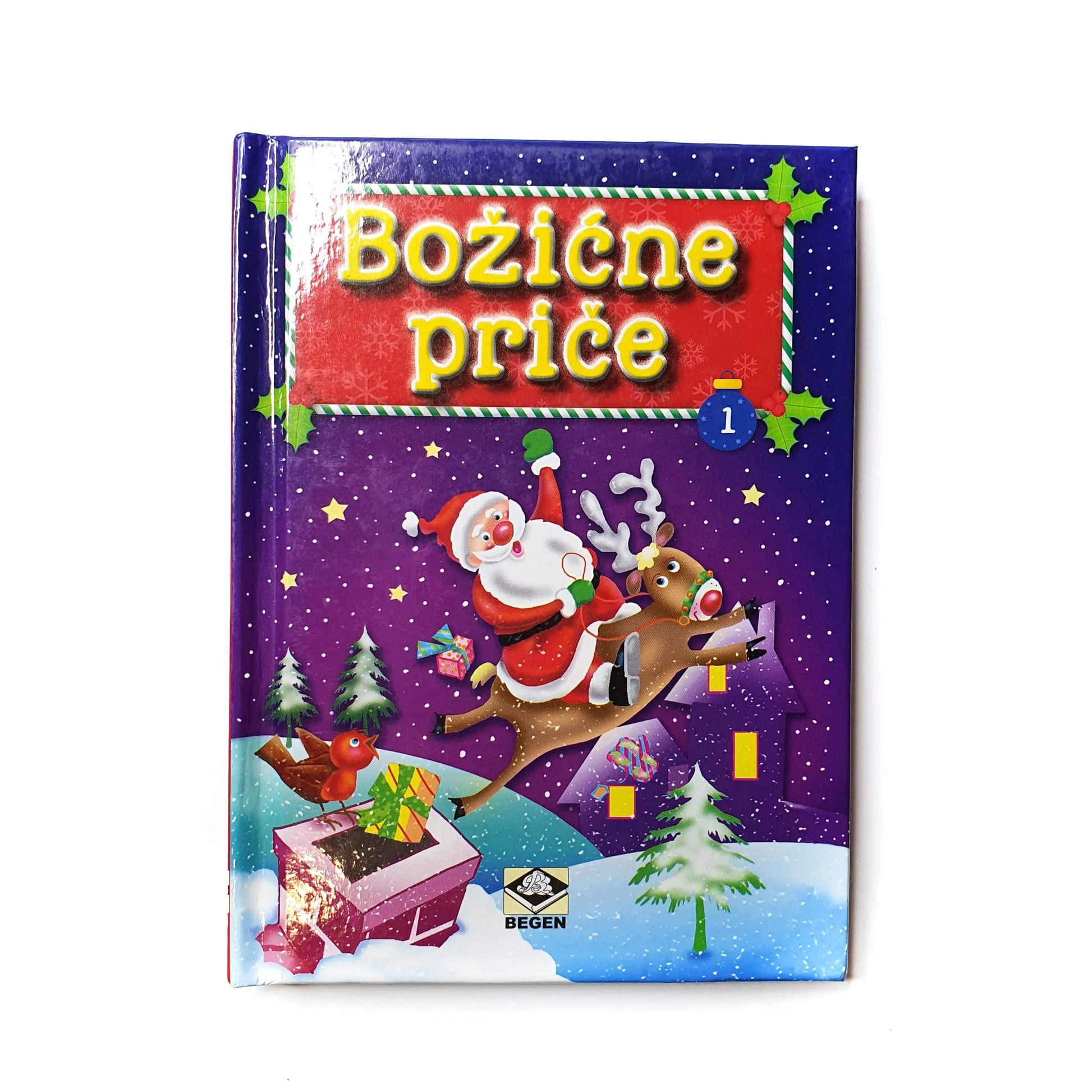 Božićne Priče Children's book titled 'Božđe príce' with a Christmas theme featuring Santa Claus and reindeer on a purple background.