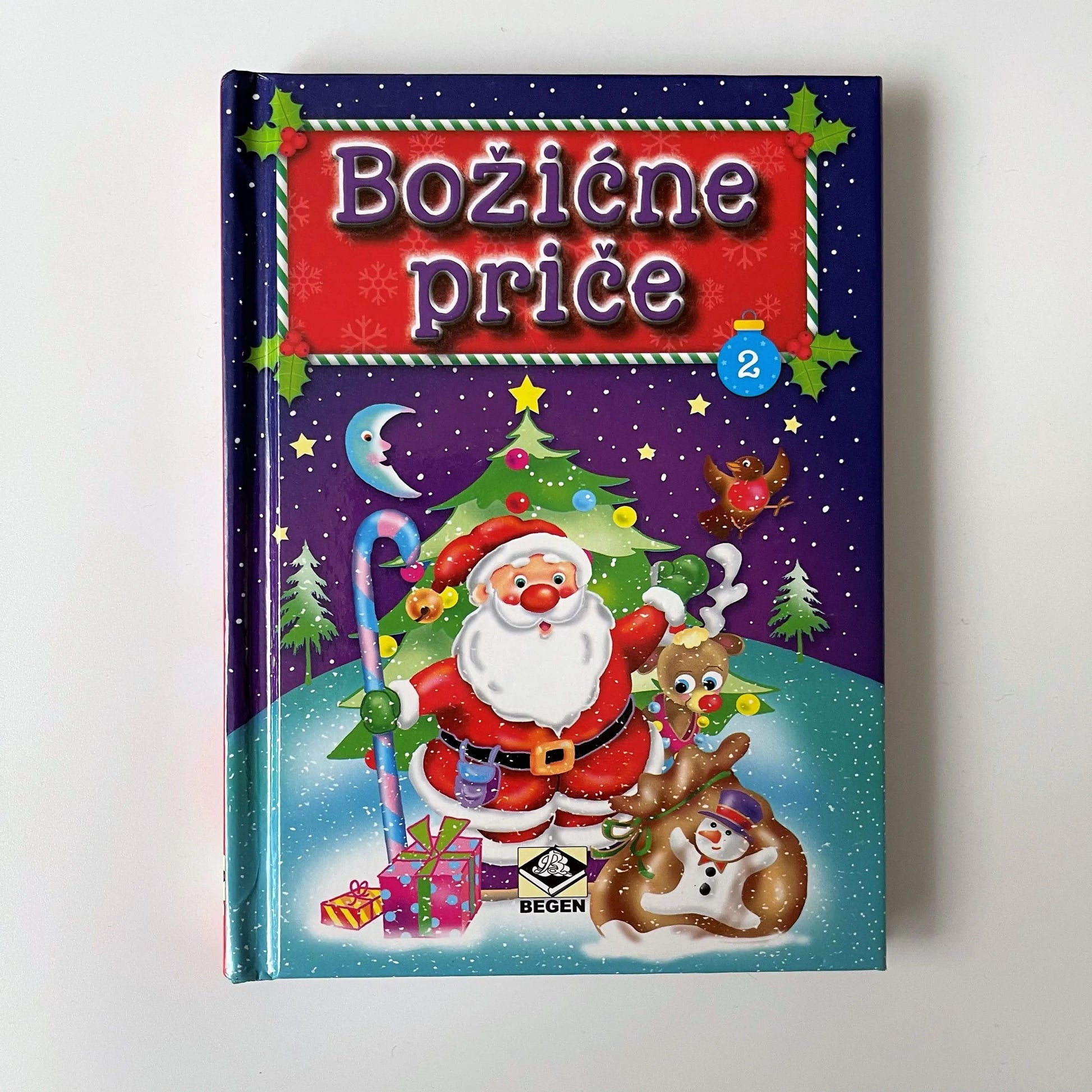 Božićne Priče Book cover with Santa Claus and Christmas elements on a purple background