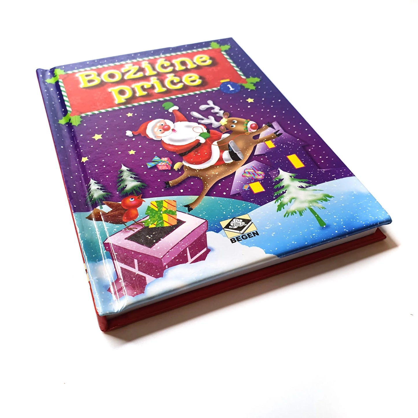 Božićne Priče Children's book with a colorful cover featuring Santa Claus and reindeer on a white background