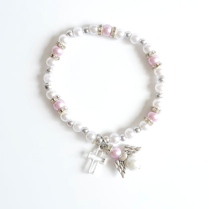 Bracelet Lilac & White Angel Cross Pearl and pink bead bracelet with a cross charm on a white background