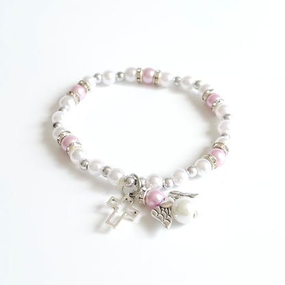 Bracelet Lilac & White Angel Cross Beaded bracelet with pink and white beads and a silver charm on a white background