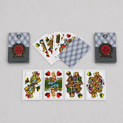 A set of illustrated playing cards and two matching card boxes arranged on a light gray background. The cards and boxes feature a blue plaid pattern with a central red oval label reading 'XL. Croatia BELOT Playing Cards - XL Size shopncro
