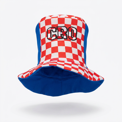 A bucket hat featuring a red and white checkered pattern on the front panel with the word 'CRO' embroidered in black and white, and a solid blue brim and side panels, shown against a light gray background. Cylinder Hat Croatia 