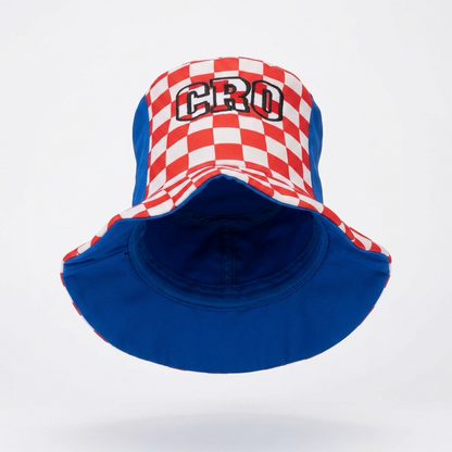 A bucket hat featuring a red and white checkered pattern on the crown with 'CRO' embroidered in black and white on the front, and a solid royal blue brim and side panels, shown against a plain white background. Cylinder Hat Croatia 