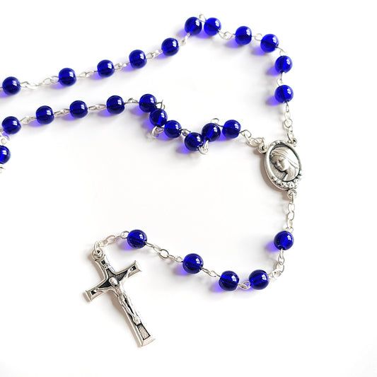 Dark Blue Catholic Rosary – Silver Crucifix & Marian Medal Blue rosary with silver cross and medal on a white background