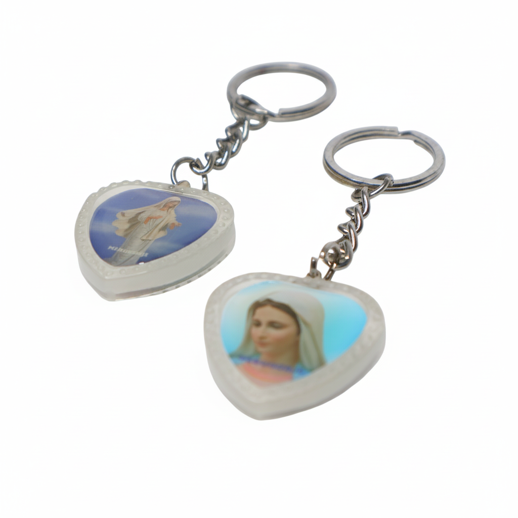 Heart-Shaped Catholic Keyring - Virgin Mary of Medjugorje Heart-shaped keychain with religious imagery on a white background