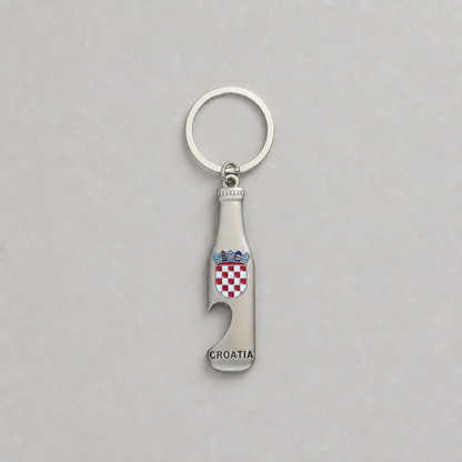 Keyring Croatia with Bottle Opener A silver metal bottle-shaped keychain with a built-in bottle opener, featuring the red and white checkered Croatian coat of arms and the word 'CROATIA' engraved near the bottom, shown on a light gray background.