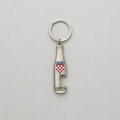 Keyring Croatia with Bottle Opener A silver-tone metal keychain shaped like a Croatia wine bottle opener, featuring the Croatian coat of arms and the word 'CROATIA' engraved at the bottom, shown on a neutral gray background.