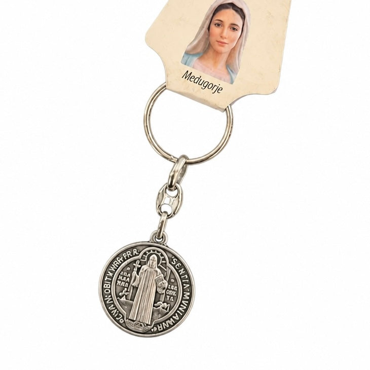 Međugorje Keyring Saint Benedict Medal in Silver Silver-tone Saint Medgarie religious keychain with a round medallion charm and a cream-colored paper tag featuring a portrait of Saint Medgarie.