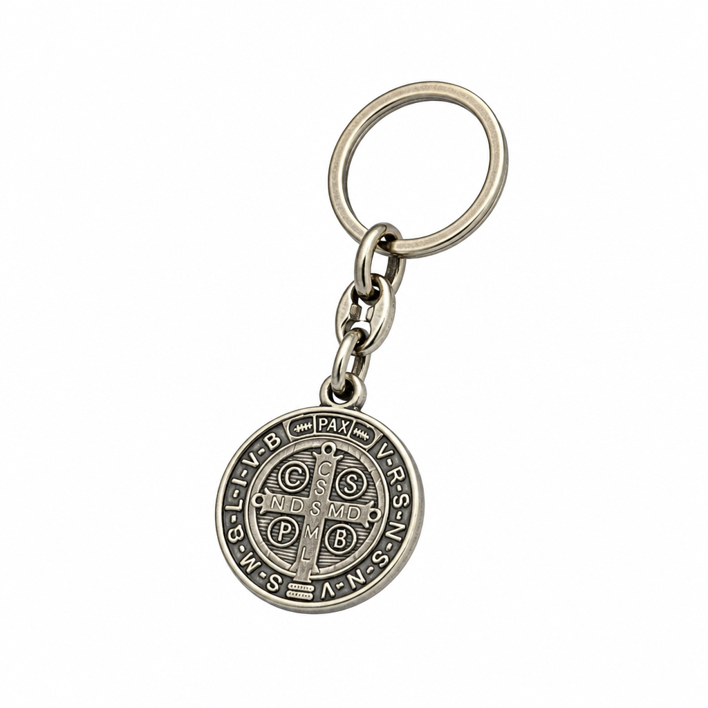 A silver cross pendant necklace with clear baguette and round-cut stones, suspended from a delicate silver chain against a plain white background. Međugorje Keyring Saint Benedict Medal in Silver