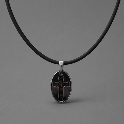 Oče Naš Necklace – Sliding Pendant Black leather necklace with a silver cross pendant on a gray background