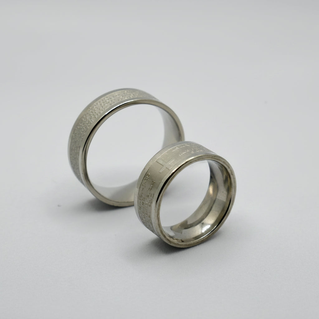 Oče Naš Ring – Silver Finish (17 – 22 Sizes) Two silver rings with size labels on a white background