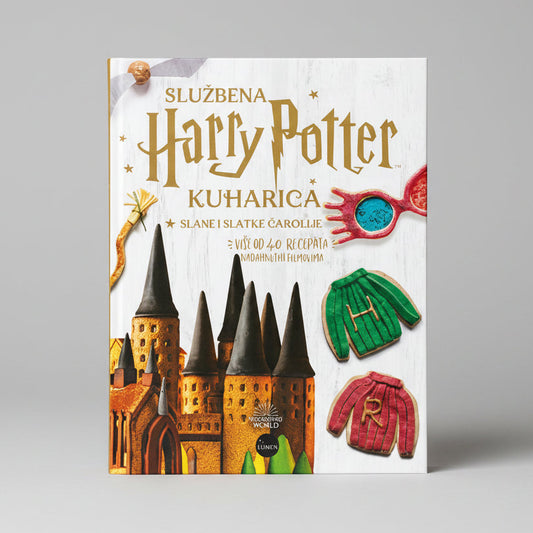 Official Harry Potter Cookbook - Slane i Slatke čarolije Book cover of 'Harry Potter' themed cookbook with cookies shaped like castle, sweater, and hand.
