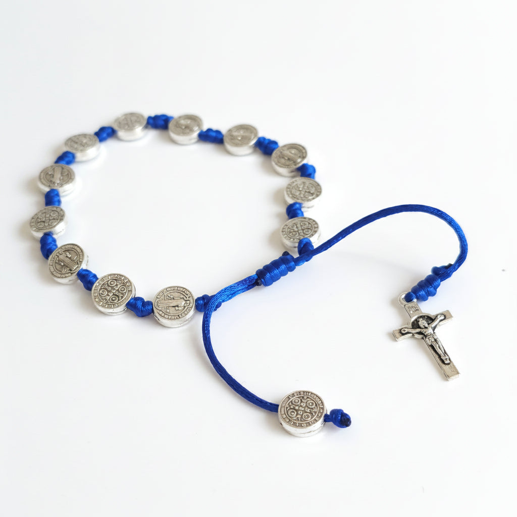 Saint Benedict Adjustable Bracelet with Cross (Blue) Blue and silver beaded necklace on a white background