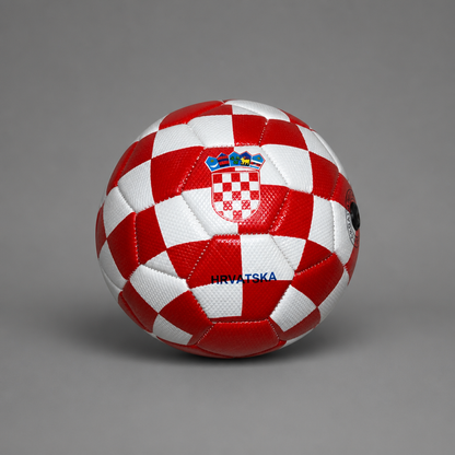 A red and white checkered soccer ball with the Croatian coat of arms and 'HRVATSKA' text, photographed on a neutral gray background. Soccer Ball Croatia Checks (half size)