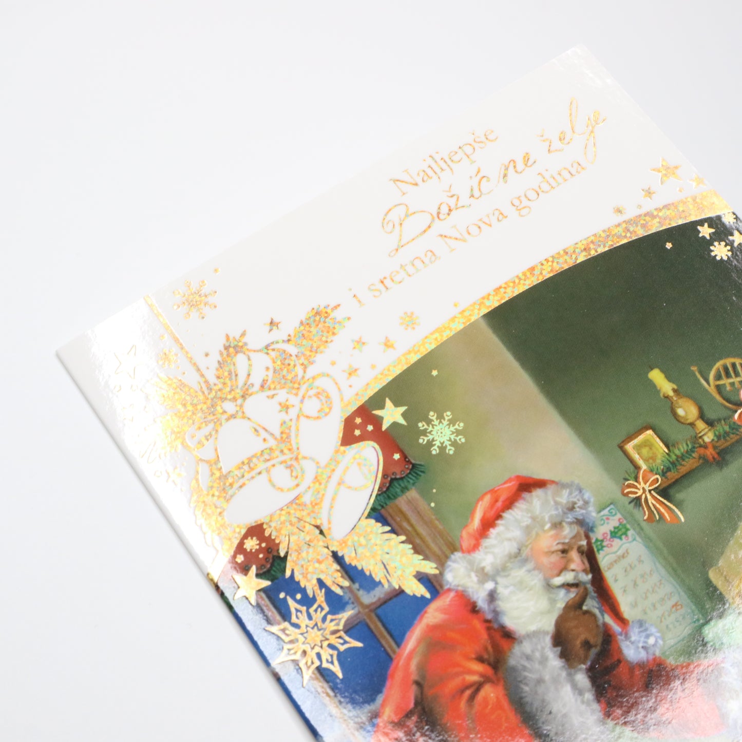 Sretan Božić Santa Christmas Greeting Card  Vintage-style Christmas card with Santa Claus and decorative elements on a white background